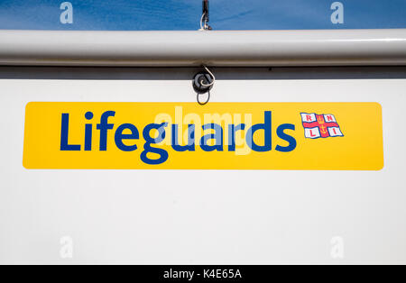 SWANAGE, UK - AUGUST 16TH 2017: A Lifeguard sign on a kiosk on Swanage seafront in Dorset, UK, on 16th August 2017. Stock Photo