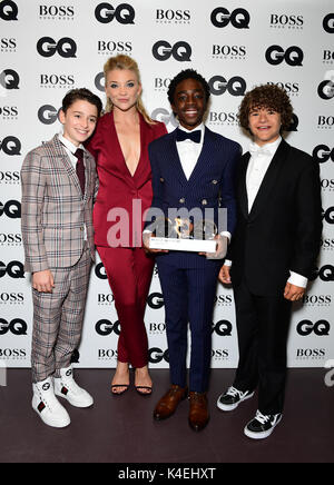 Noah Schnapp (left), Caleb McLaughlin (centre) and Gaten Matarazzo with the Editor's Special award presented to Stranger Things pose with Natalie Dormer during the GQ Men of the Year Awards 2017 held at the Tate Modern, London. Stock Photo