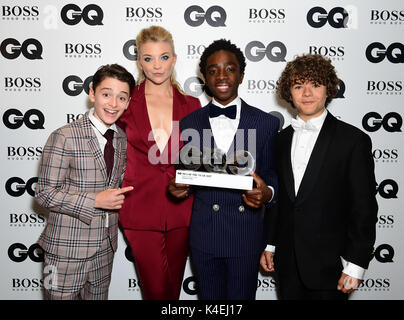 Noah Schnapp (left), Caleb McLaughlin (centre) and Gaten Matarazzo with the Editor's Special award presented to Stranger Things pose with Natalie Dormer during the GQ Men of the Year Awards 2017 held at the Tate Modern, London. Stock Photo