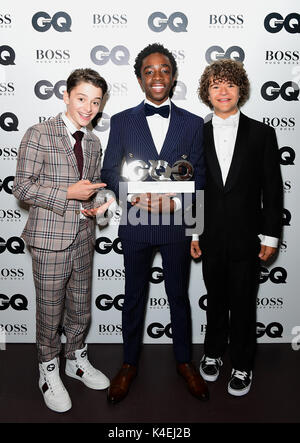 Noah Schnapp (left), Caleb McLaughlin (centre) and Gaten Matarazzo with the Editor's Special award presented to Stranger Things during the GQ Men of the Year Awards 2017 held at the Tate Modern, London. Stock Photo