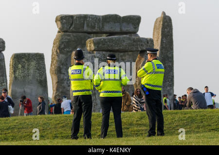 Police patrol at Stonehenge prehistoric  monument in Wiltshire, England United Kingdom UK Stock Photo