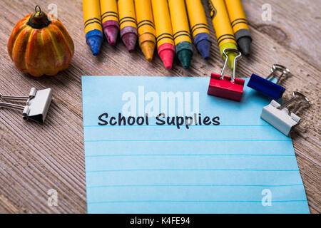 Back to School concept on notebook and wooden board Stock Photo