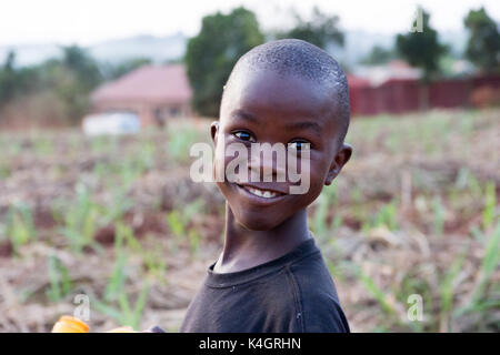 A little black Ugandan boy with a funny facial expression Stock Photo