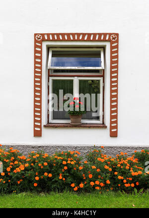 Beautiful country house window with flowers Stock Photo