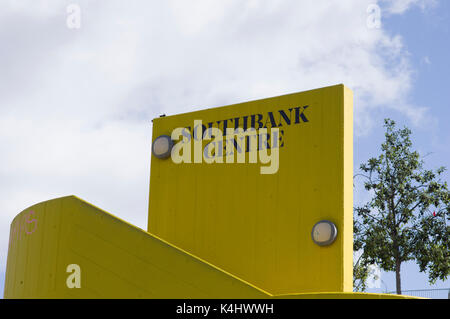 Southbank Centre black letters on yellow brick background with a blue sky and clouds on a sunny day in London Stock Photo