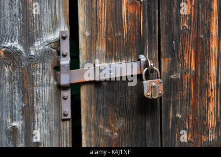 Rusty door handle with door lock on old wooden door, Baden-Württemberg, Germany Stock Photo
