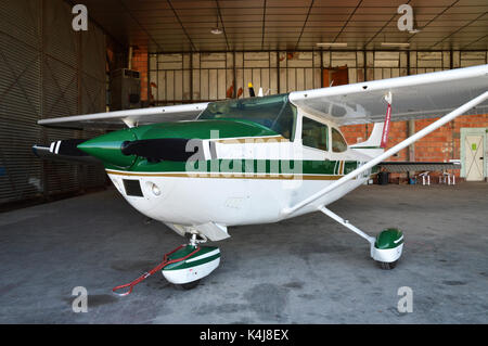A small plane, parked in hangar airplane. Stock Photo