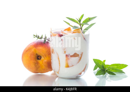 Sweet home-made yogurt with pieces of peach Stock Photo