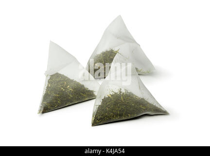 Triangle bags with matcha tea on white background Stock Photo