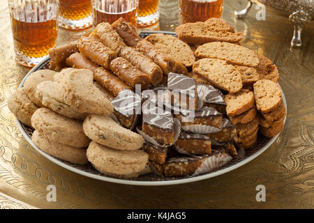 Traditional variety of festive Moroccan cookies and mint tea Stock Photo