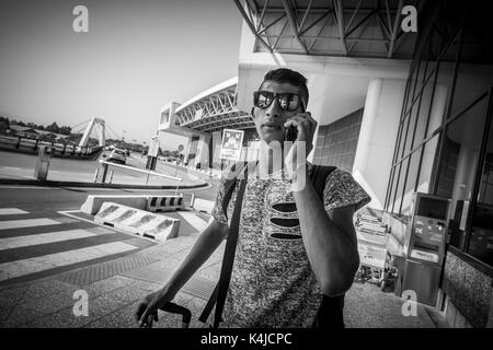 Italy, Milan, Malpensa airport, young Egyptian migrant returns to his country after five years away from the family Stock Photo