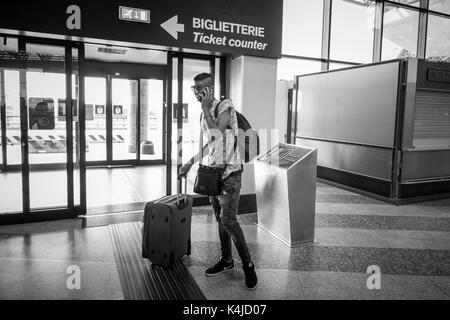 Italy, Milan, Malpensa airport, young Egyptian migrant returns to his country after five years away from the family Stock Photo