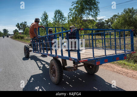 People sitting in trailer on road, Siem Reap, Cambodia Stock Photo