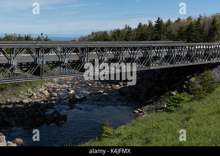 Bridge across river in forest, Pleasant Bay, Cape Breton Highlands National Park, Cape Breton Island, Nova Scotia, Canada Stock Photo