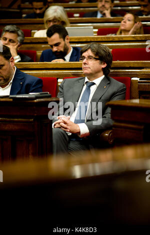 Barcelona, Spain. 06th Sep, 2017. September 6, 2017 - Barcelona, Catalonia, Spain - Catalan regional president CARLES PUIGDEMONT (C) during the parliamentary session in the Catalonia Parliament. The Catalan Parliament has passed a law to call a referendum of independence the next first of October. The unionist forces of Catalonia and the Spanish government are frontally opposed to the referendum and consider it illegal. Credit: Jordi Boixareu/Alamy Live News Stock Photo