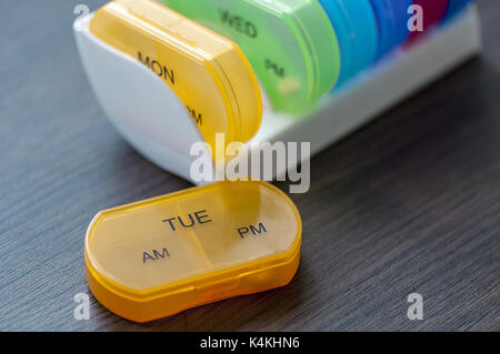 Close-up of medicine dose box. Prescription pills in a pill box. Stock Photo