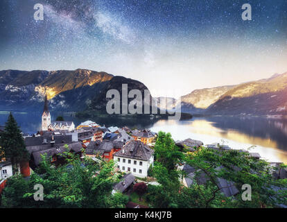 Scenic panoramic view of the famous mountain village in the Austrian Alps. Fantastic milky way. Hallstatt. Austria Stock Photo