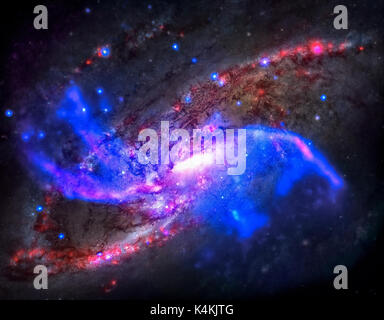 Spiral galaxy M106. It located in the constellation Canes Venatici. NGC 4258 is a spiral galaxy like the Milky Way. Retouched colored image. Elements  Stock Photo