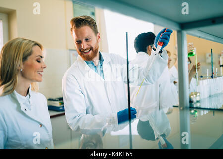 Young students of chemistry working in laboratory Stock Photo