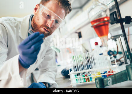 Attractive student of chemistry working in laboratory Stock Photo