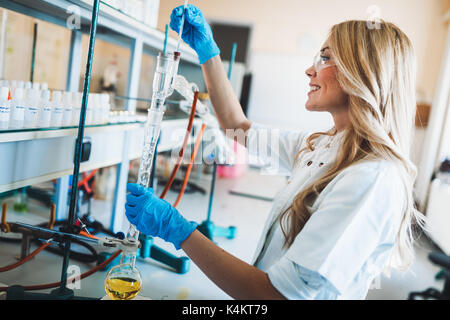Female student of chemistry working in laboratory Stock Photo