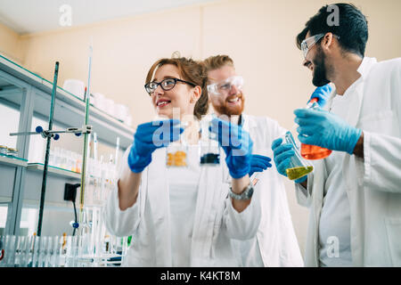 Group of chemistry students working in laboratory Stock Photo