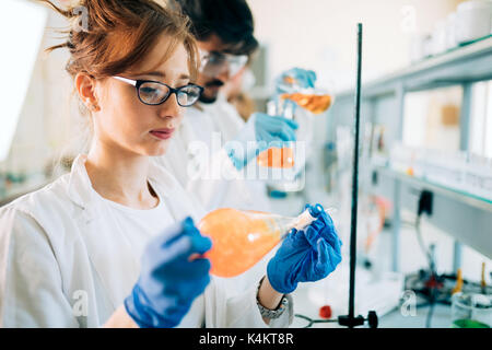 Young students of chemistry working in laboratory Stock Photo