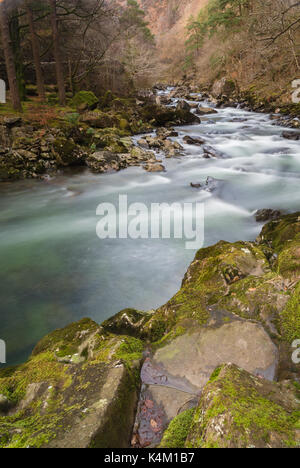 Glaslyn River flowing through the Aberglaslyn Pass in Snowdonia National Park, Wales renowned for its clear water and scenic beauty. Stock Photo