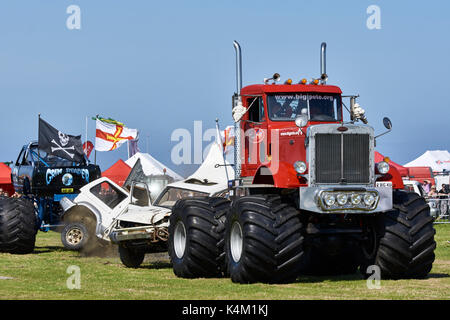 Wrecker Trucks Demonstration Guernsey, West Show,  Horticulture and Agriculture. Tug Of War wrecking a car between two trucks. 'Big Pete'. Stock Photo