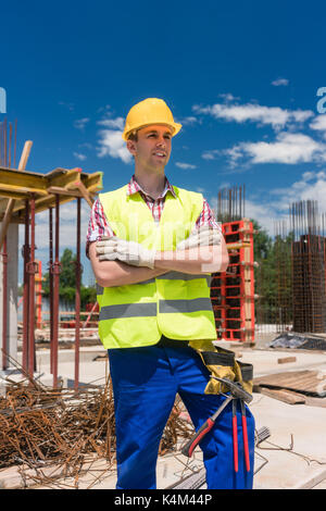 Portrait of a determined young worker looking at camera with con Stock Photo