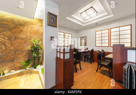 The interior is modern Japanese restaurant Ichiban Boshi. Small hall Stock Photo