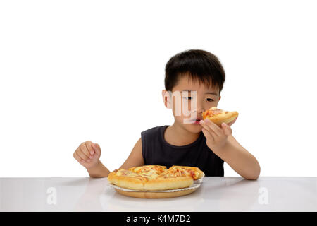 Asian boy staring at pizzas in hand with suspicious eyes, Isolated over white background. Stock Photo