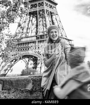 Autumn getaways in Paris with family. happy mother and daughter tourists on embankment in Paris, France playing outside Stock Photo