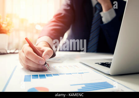 Professional manager working with finance document. Accountant signing finance report. Analysis working budget accounting startup economy man concept Stock Photo