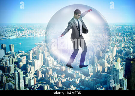 Businessman flying inside the bubble Stock Photo