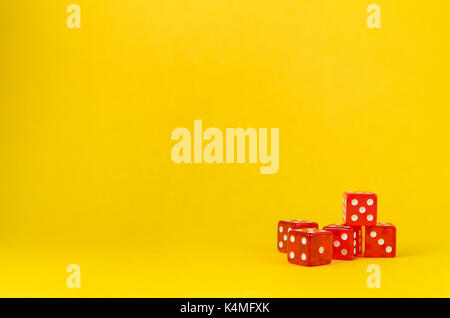 5 dice on yellow background, poker dice. Stock Photo