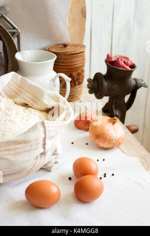 Ingredients for dumplings or pelmeni, rustic style, selective focus. Stock Photo