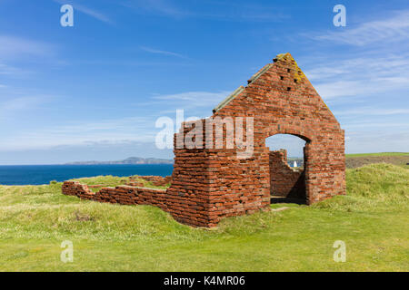 Red brick buildings, ruins of the industrial quarrying activity near to Porthgain harbour, Pembrokeshire, Wales, United Kingdom, Europe Stock Photo