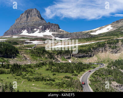 Red Jammer on Going-To-The-Sun highway, Glacier National Park, Montana Stock Photo
