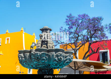 Fountain in the Artists Quarter with colorful colonial buildings in Puebla, Mexico Stock Photo