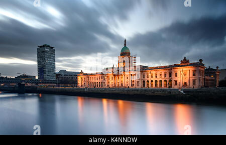 View of Custom House on the bank of river Liffey under dark cloudy skyline, Dublin, Ireland Stock Photo