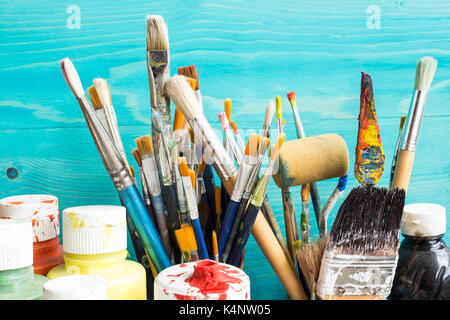 Painting equipment, paint  and   brushes on a blue background. Stock Photo