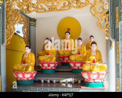 Small Buddha shrine in a Phu Quoc isand temple, South Vietnam Stock Photo