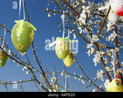 Easter eggs decorated on blooming tree Stock Photo
