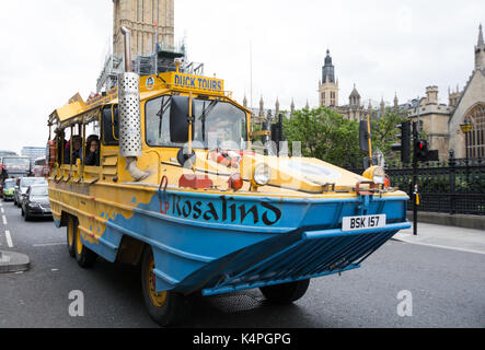 A distinctive London Duck Tours amphibious bus in Parliament Square. Stock Photo