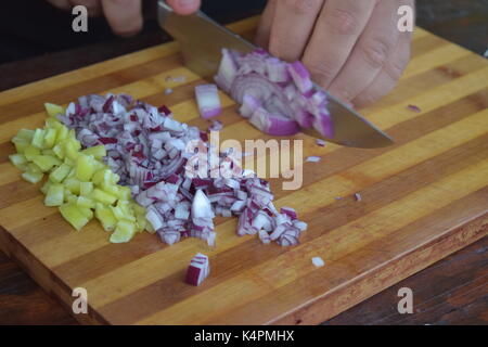 Male hands chopping onions Stock Photo