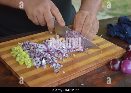 Male hands chopping onions Stock Photo