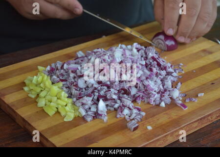 Close up of a chef's hands chopping Stock Photo
