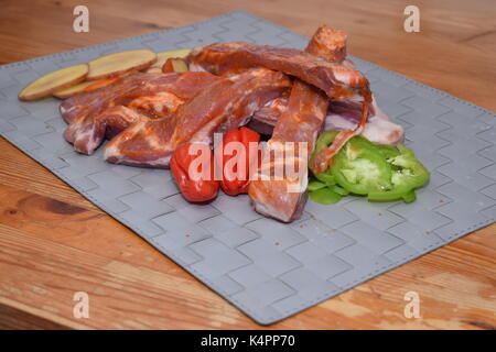 Raw beef ribs with organic vegetables Stock Photo