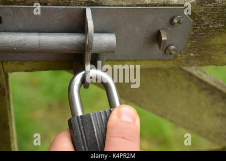 Padlock on a wooden gate Stock Photo